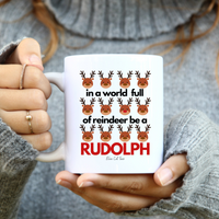 
              In A World Full Of Reindeer Be A Rudolph Christmas White Coffee Mug From Blue Cat Tees
            